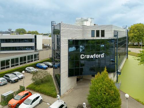 Exterior view of an office building at Vlierbaan 20, Capelle aan den IJssel, suitable for office space rental with ample parking available.