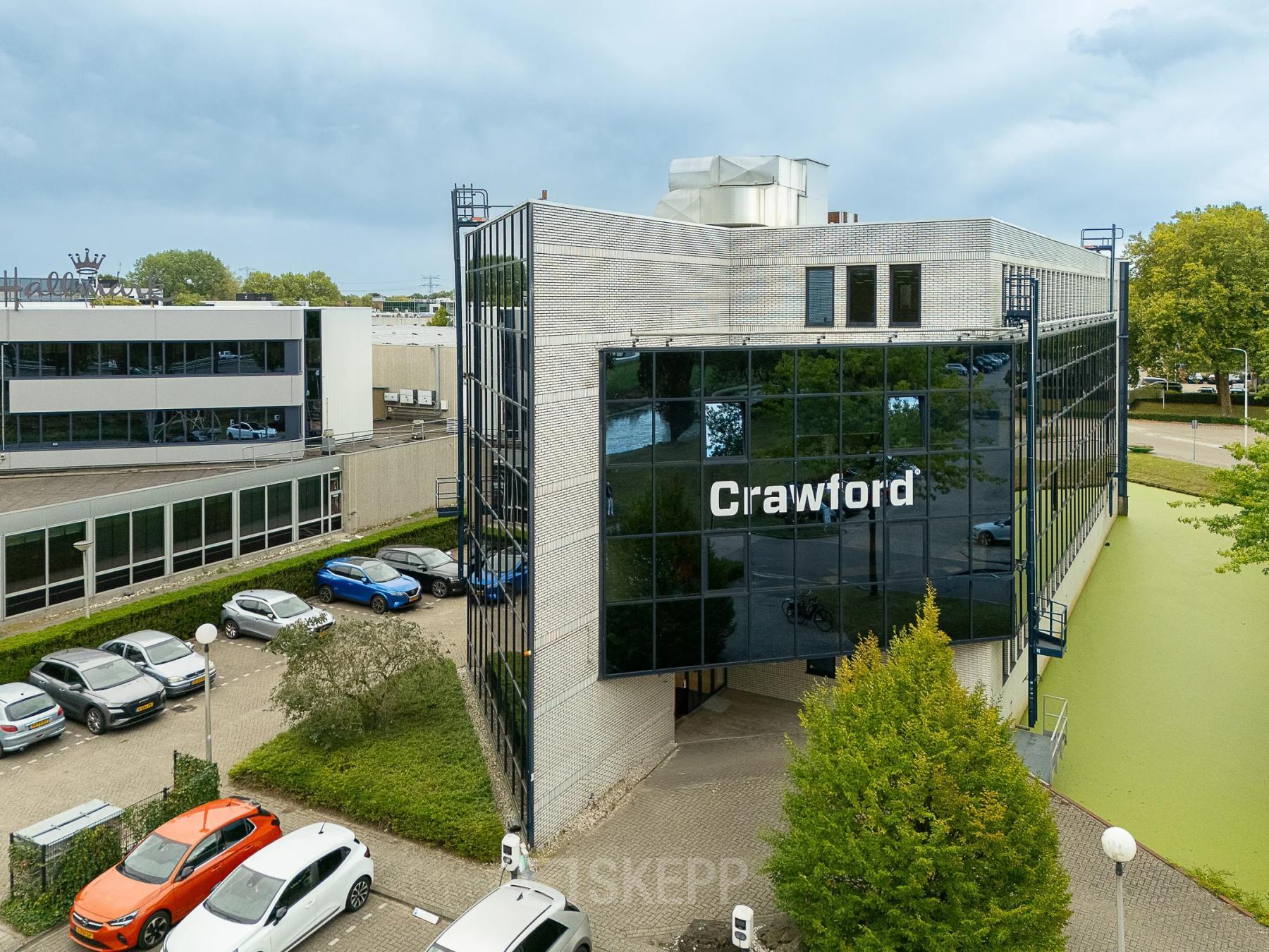 Exterior view of an office building at Vlierbaan 20, Capelle aan den IJssel, suitable for office space rental with ample parking available.