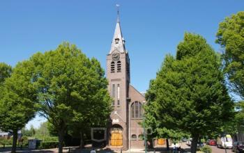 Office space rental available at Strijkviertel 63 in De Meern, featuring a distinct brick building surrounded by lush greenery.