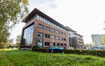 Exterior view of the office building located at Marshalllaan 2, Delft, ideal for office space rental with parking available.