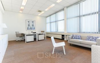 Bright office space with large windows and modern furnishings, perfect for office space rental in Delft at Marshalllaan 2.