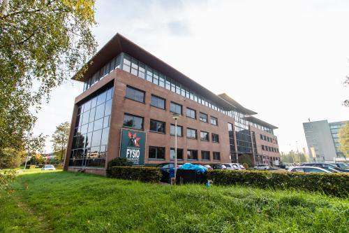 Exterior view of the office building located at Marshalllaan 2, Delft, ideal for office space rental with parking available.