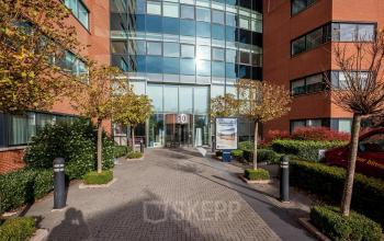 Exterior view of the office building at Olof Palmestraat 10 in Delft, featuring a modern facade. Ideal for those seeking an office to rent in a dynamic location.
