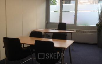 A well-lit office space rental at Eemweg 1-9, Den Bosch, with clean lines and modern furniture.