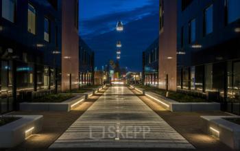 Stylish night view of the exterior buildings at Utopialaan 22, Den Bosch, featuring modern architecture. Ideal for businesses seeking office space rental in a vibrant location.