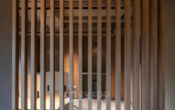 Modern office interior at Pettelaarpark 110, Den Bosch, featuring stylish wooden partitions and contemporary furnishings, available for office space rental.