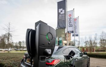 Exterior view of Pettelaarpark 110 in Den Bosch featuring a modern electric vehicle charging station, suitable for those seeking office space rental with sustainable amenities.