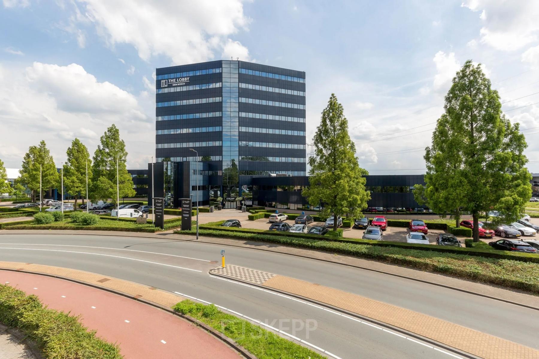 Exterior view of a modern office building at Reitschweg 1 in Den Bosch, showcasing available office space rental opportunities.