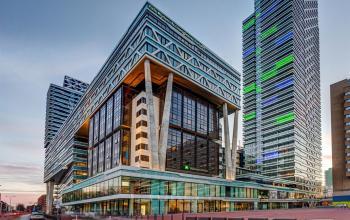Modern exterior view of an office building at Anna van Buerenplein 41, The Hague Center, showcasing striking architecture ideal for office space rental.