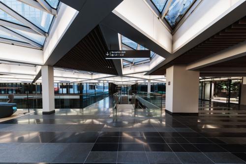 Modern office entrance at Anna van Buerenplein 41, The Hague Center, showcasing spacious architecture ideal for office space rental.