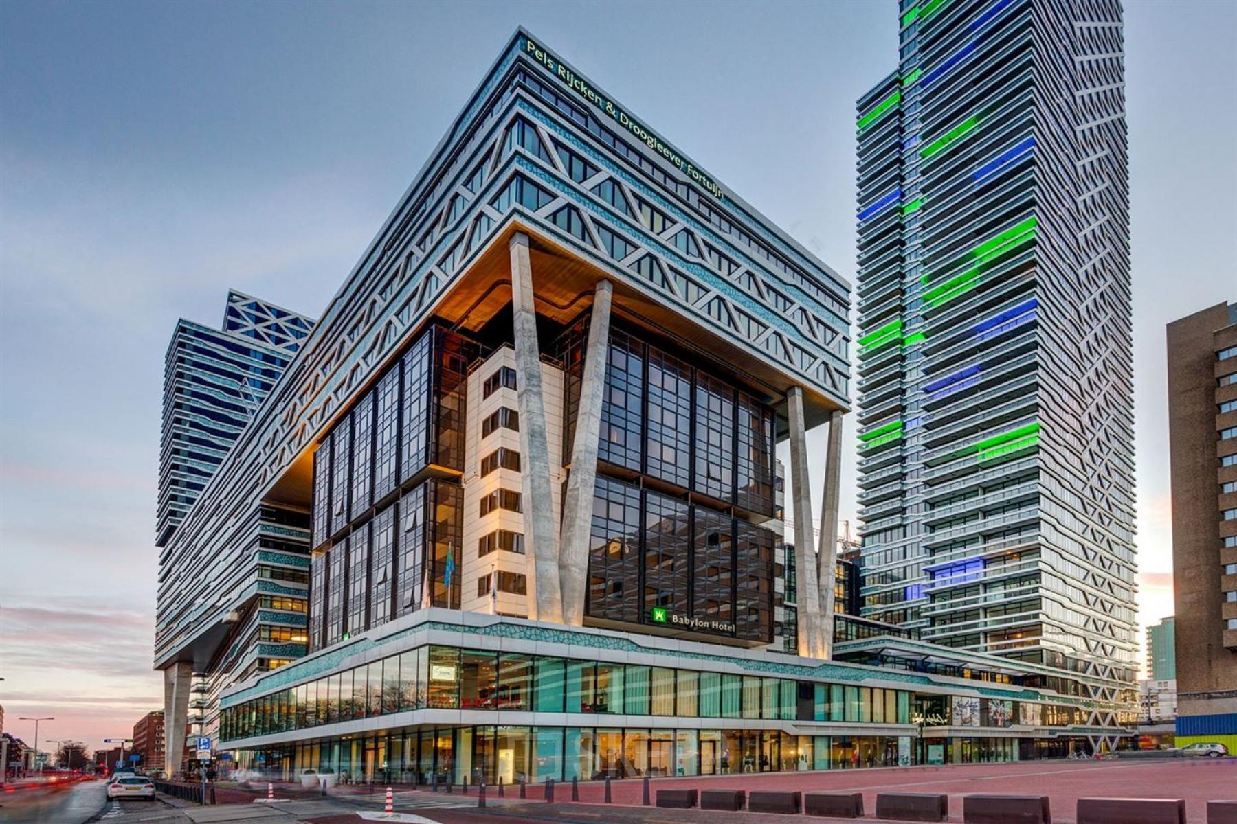 Modern exterior view of an office building at Anna van Buerenplein 41, The Hague Center, showcasing striking architecture ideal for office space rental.