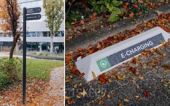 Exterior of office building located on Zeestraat 70, The Hague Center, The Hague, with surrounding greenery and charging station for electric vehicles.