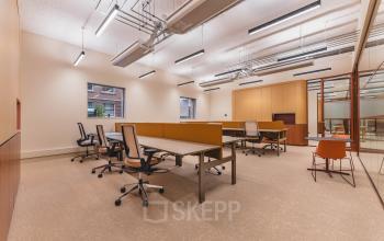 Modern office space at Zeestraat 70 in The Hague Center featuring spacious, well-lit workstations. Ideal for office space rental with functional arrangements and ample room for productivity.