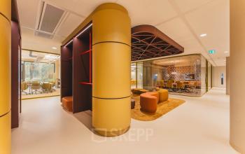 Modern office interior at Zeestraat 70, The Hague, featuring vibrant decor and spacious conference rooms, ideal for office space rental.