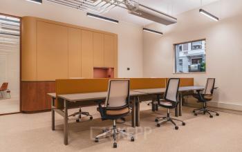 Modern office interior at Zeestraat 70, The Hague Center, featuring a spacious open floor plan with ergonomic chairs and ample lighting, perfect for office space rental.