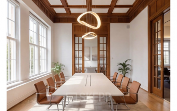 Sleek, furnished conference room at Mauritskade 9 in The Hague Center, ideal for office space rental with elegant lighting and natural light.