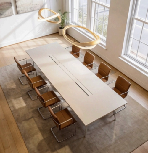 Bright office space with a long conference table and chairs, large windows providing natural light, ideal for office space rental at Mauritskade 9, The Hague Center.