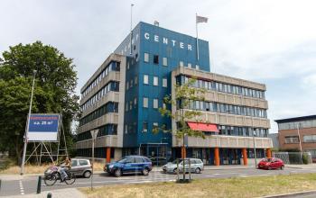 Exterior view of an office building at Platinaweg 25, The Hague Escamp, offering office space rental in a multi-story structure.