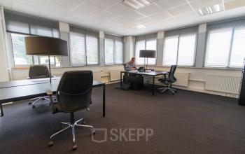 Spacious office at Platinaweg 25, The Hague Escamp, featuring modern furniture and a professional working environment. Rent office space here with ample room for productivity.
