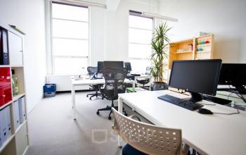 A well-lit office with modern furnishings at Zuid Hollandlaan 7, ideal for a team seeking office space rental in The Hague Haagse Hout area.