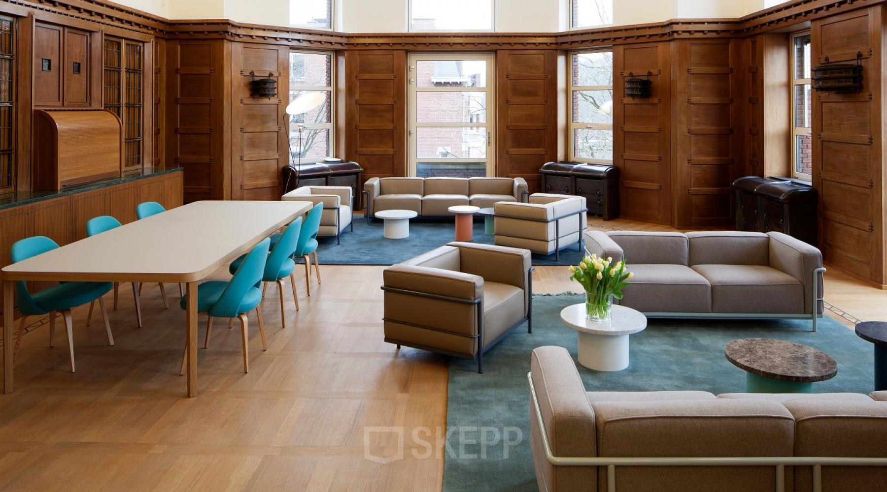 Elegant office lounge area with contemporary furniture offering a relaxed atmosphere for an office space rental at Zuid Hollandlaan 7, The Hague Haagse Hout.
