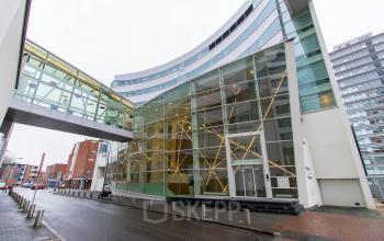 Modern office space rental at Jan Pietersz. Coenstraat 7, The Hague Haagse Hout with a clear glass facade and a sleek design.