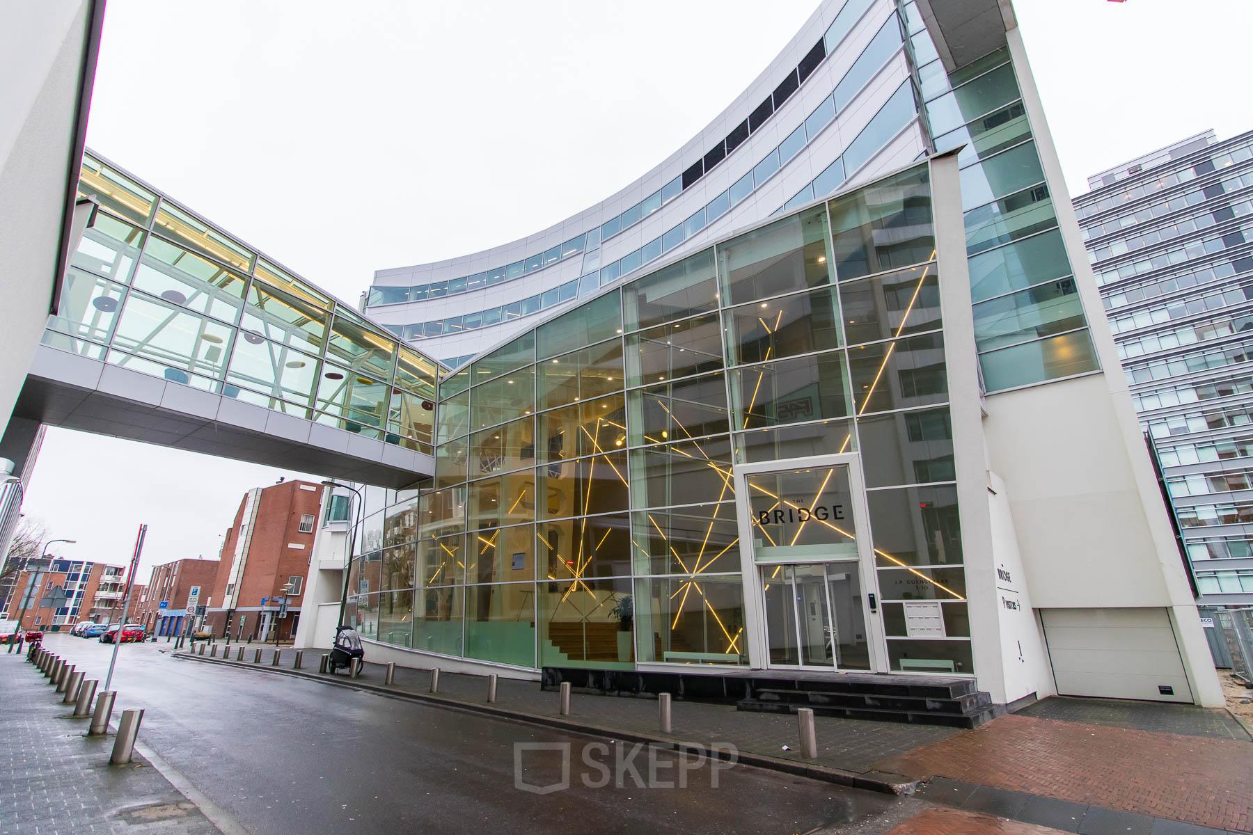 Modern office space rental at Jan Pietersz. Coenstraat 7, The Hague Haagse Hout with a clear glass facade and a sleek design.