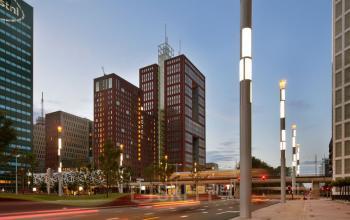 A modern exterior view of Prinses Margrietplantsoen 25 in The Hague Haagse Hout, featuring high-rise office buildings with striking architecture, ideal for office space rental.