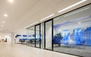 Modern office interior in The Hague Haagse Hout with glass partitions, open workspaces, and contemporary decor for rent office space.