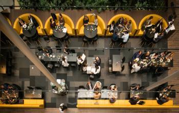 Modern office space with vibrant seating areas at Prinses Margrietplantsoen 25, The Hague, Haagse Hout, ideal for collaborative work and networking, available for office space rental.