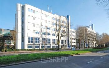 Exterior view of the office building at Johan de Wittlaan 7, The Hague Statenkwartier, perfect for office space rental. The white modern facade and large windows hint at a professional workspace inside.