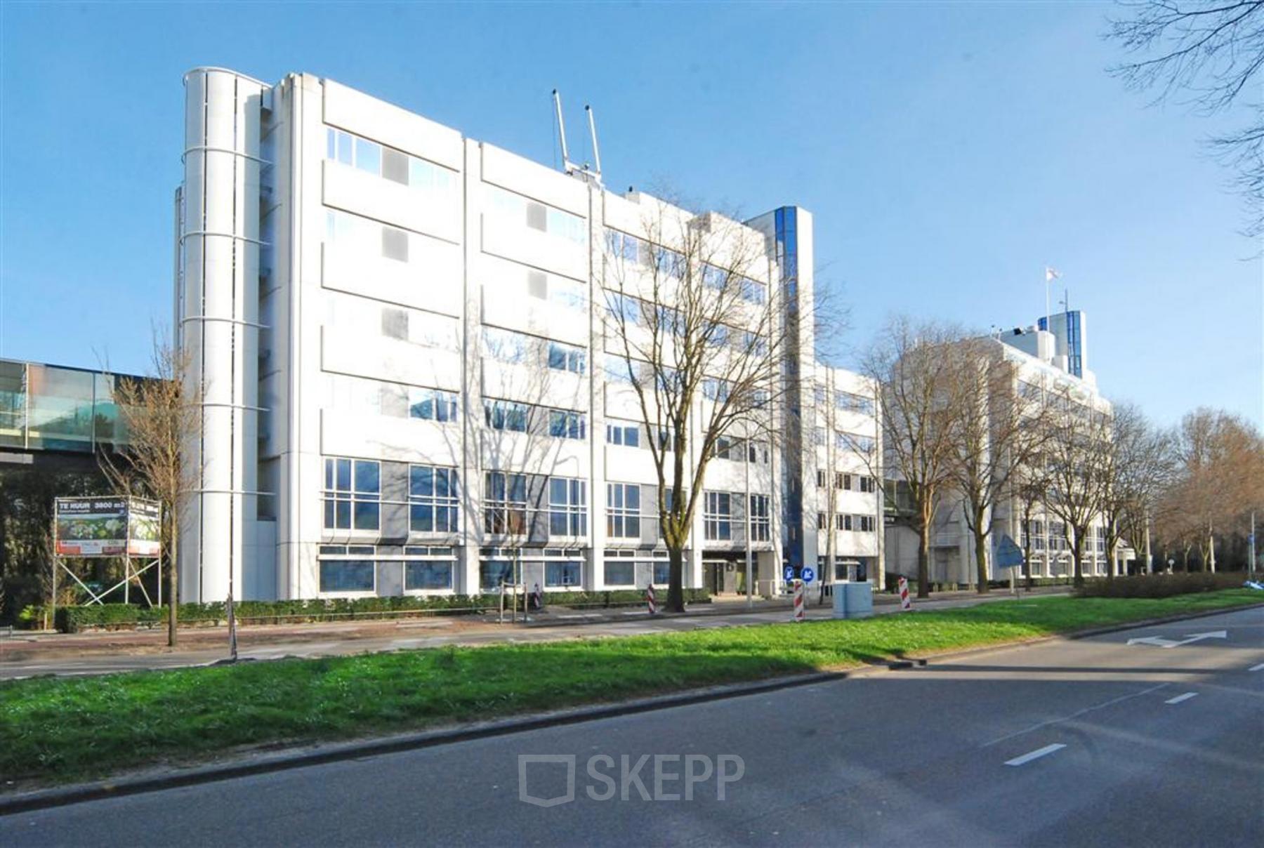 Exterior view of the office building at Johan de Wittlaan 7, The Hague Statenkwartier, perfect for office space rental. The white modern facade and large windows hint at a professional workspace inside.