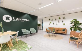 Brightly lit office space at Zutphenseweg 29 in Deventer, featuring modern furnishings and a stylish seating area. Ideal for office space rental.