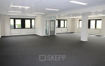 Spacious office space for rent at Keulenstraat 1 in Deventer, featuring large windows and ample natural light. Ideal for businesses seeking an open floor plan for office space rental.