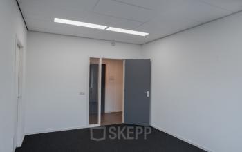 Unfurnished office room with grey carpet and white walls located at Keulenstraat 12, Deventer, available for office space rental.