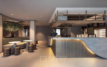 Spacious office lounge at Diemerhof 42, Diemen, featuring elegant furnishings and ample room for workspaces. Ideal for those seeking office space rental with a modern vibe.