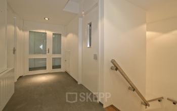 Simple and clean hallway at office space rental located at Weesperstraat 118, Diemen.