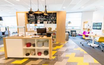 Furnished office interior at Flight Forum 40 with colorful seating and workspaces, ideal for office space rental near Eindhoven Airport.