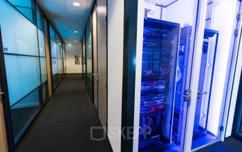 A modern server room at Flight Forum 40, Eindhoven Airport, ideal for rent office space needs with sleek design and advanced equipment.
