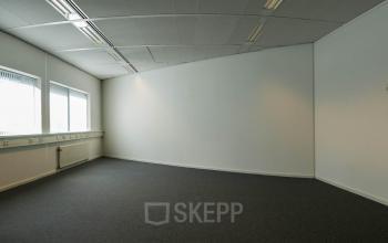 Interior view of an unfurnished office space available for rent at Luchthavenweg 55, Eindhoven Airport.