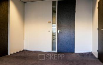 Office space rental at Luchthavenweg 55, Eindhoven Airport, with three closed doors and carpeted floor.