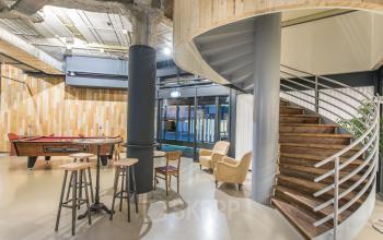 Modern office space rental at Bogert 1, Eindhoven Center, with cozy seating and a pool table for a blend of work and relaxation.