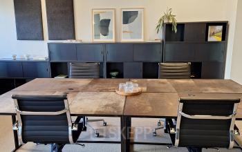 Modern conference room at Emmasingel 33 in Eindhoven Center with a large table and stylish chairs, perfect for office space rental with upscale decor.