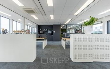 Bright office space with modern furnishings and ample natural light at Meerenakkerplein 1-10, Eindhoven De Hurk. Ideal for office space rental.