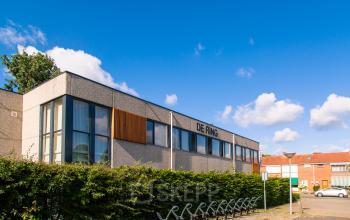 Exterior view of office building at Weegschaalstraat 3 in Eindhoven North, Eindhoven, with bike racks and labeled 'De Ring'.