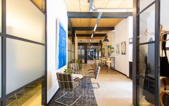 Bright and inviting workspace in Eindhoven North at Weegschaalstraat 3, perfect for office space rental with modern furnishings and cozy seating areas.