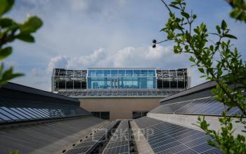 Exterior view of office building at Frederiklaan 10A, Eindhoven Strijp-S, showcasing modern architecture with large windows and solar panels.