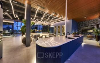 Modern office interior at Achtseweg Zuid 159R, Eindhoven Strijp-S, featuring stylish lighting and seating, perfect for office space rental.