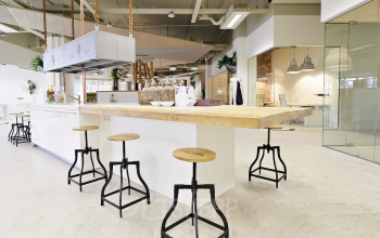 Modern office in Eindhoven Strijp-S with contemporary furnishings and open layout, ideal for office space rental. Sleek design and ample seating make this a perfect office to rent.