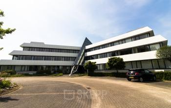 Modern office building with parking space